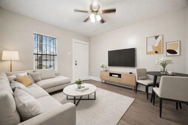 a living room with furniture and a flat screen tv