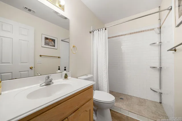 a view of a livingroom with furniture and staircase