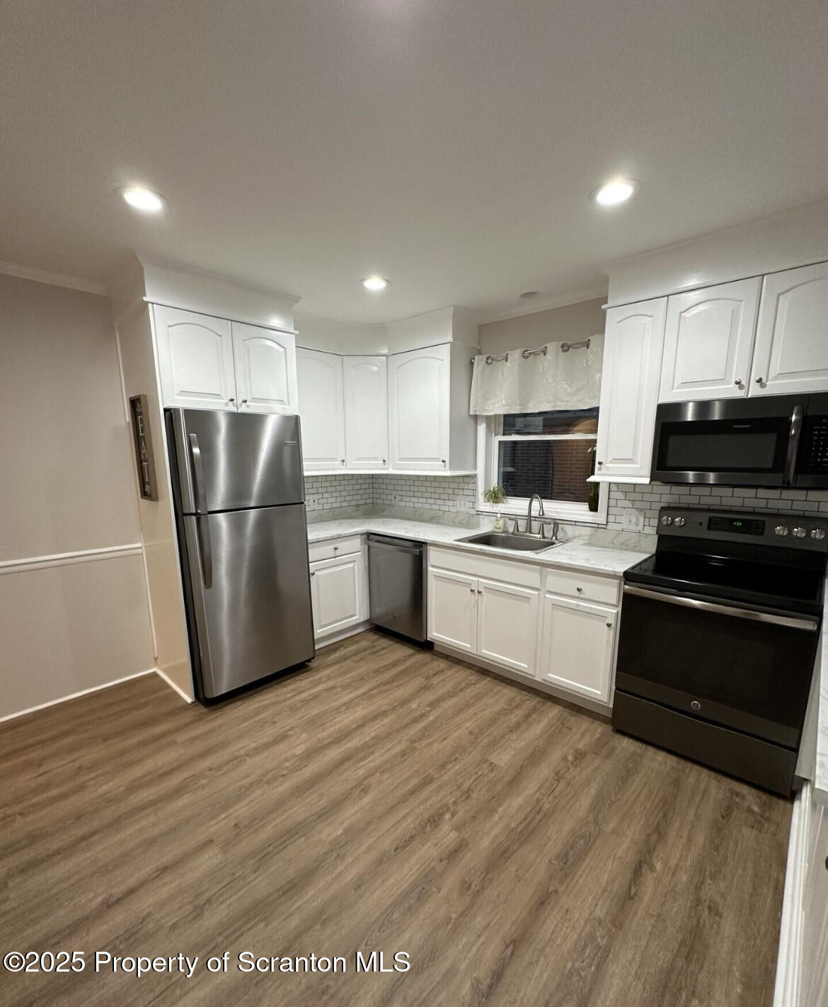 2008 South Webster Avenue Scranton, PA 18505 - Photo 2 of 10 a kitchen with wooden cabinets and stainless steel appliances