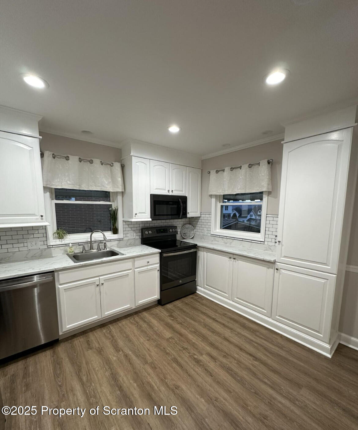 2008 South Webster Avenue Scranton, PA 18505 - Photo 3 of 10 a large kitchen with cabinets wooden floor and stainless steel appliances