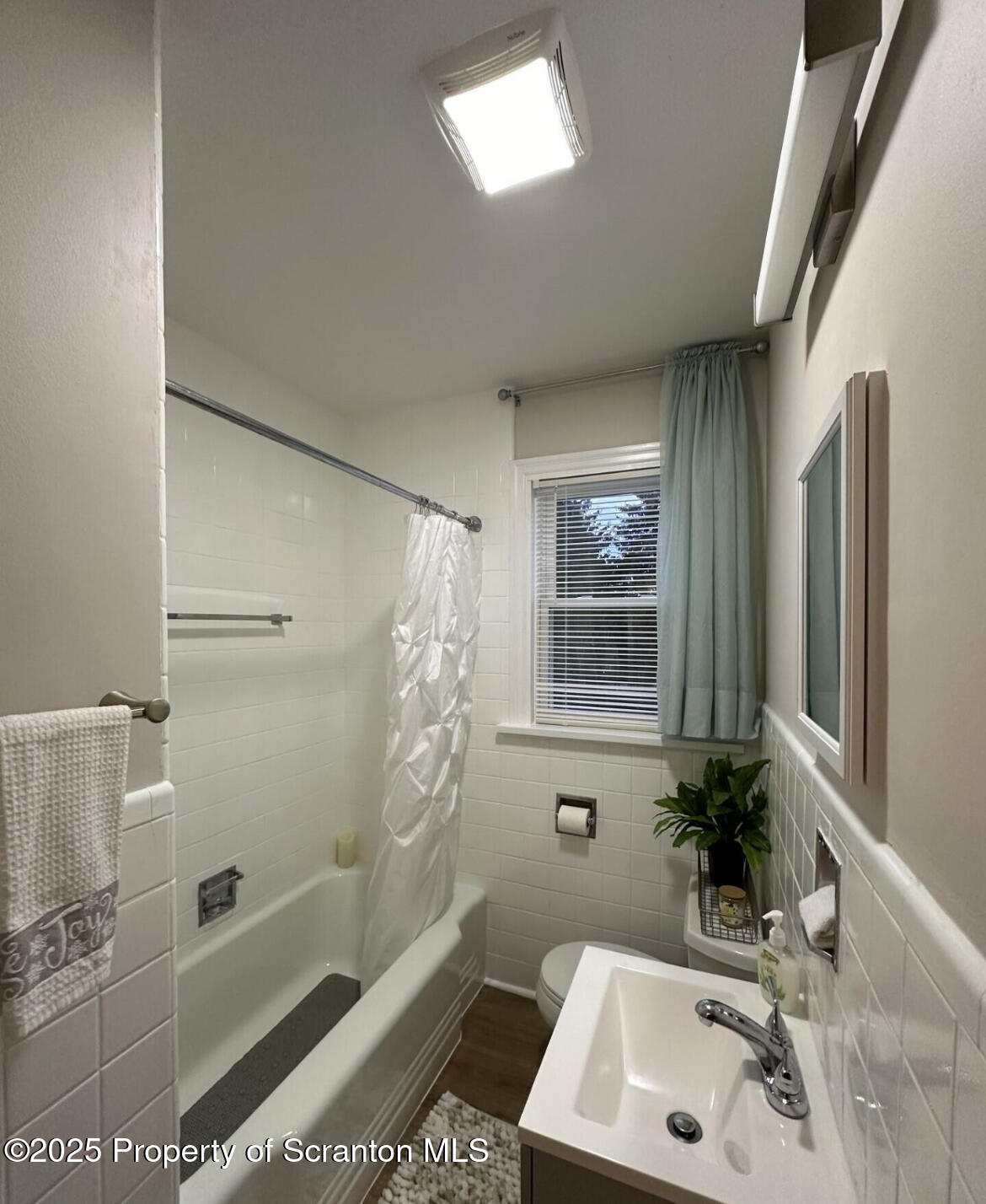 2008 South Webster Avenue Scranton, PA 18505 - Photo 5 of 10 a bathroom with a sink a toilet and shower