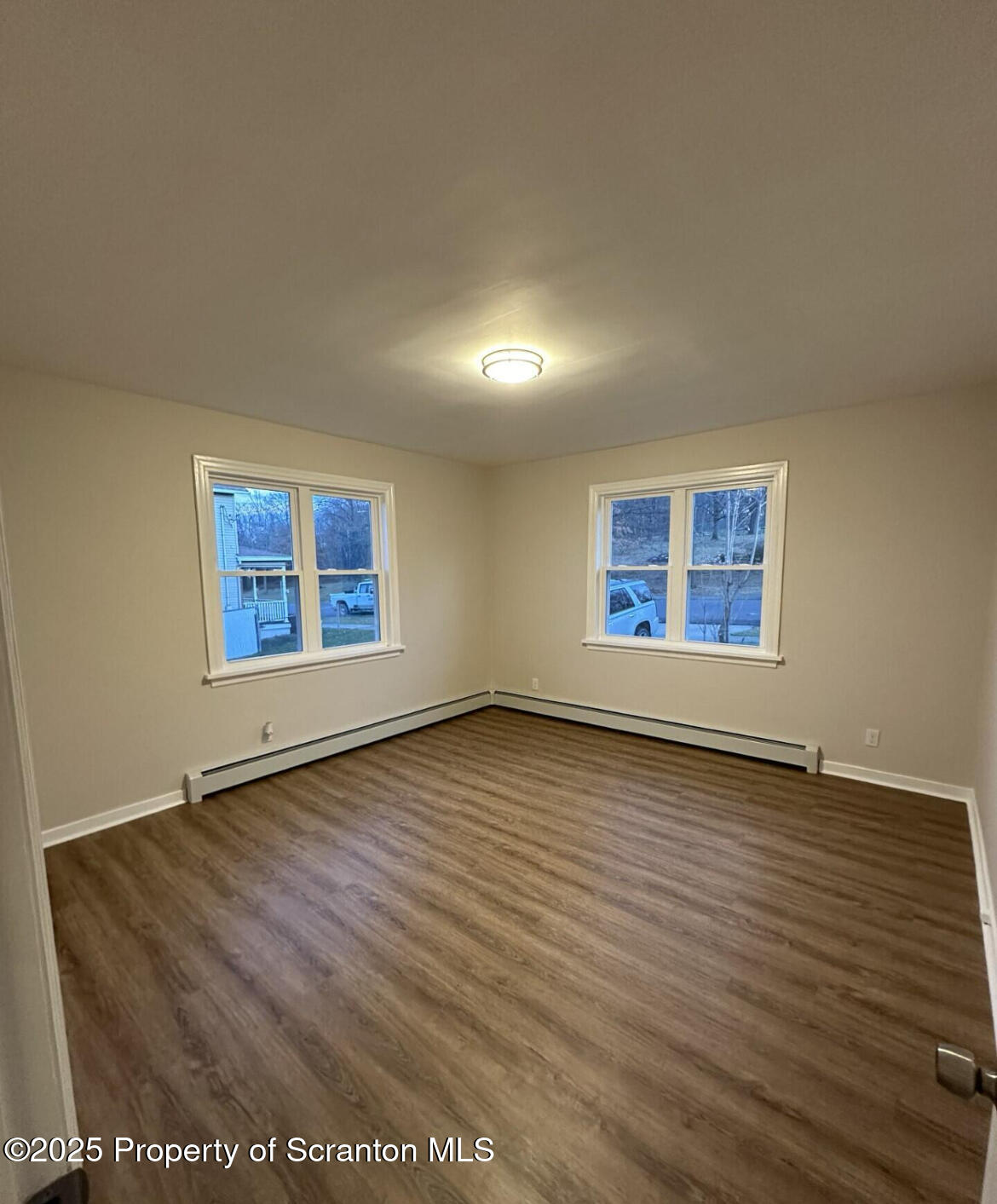 2008 South Webster Avenue Scranton, PA 18505 - Photo 7 of 10 an empty room with wooden floor and windows
