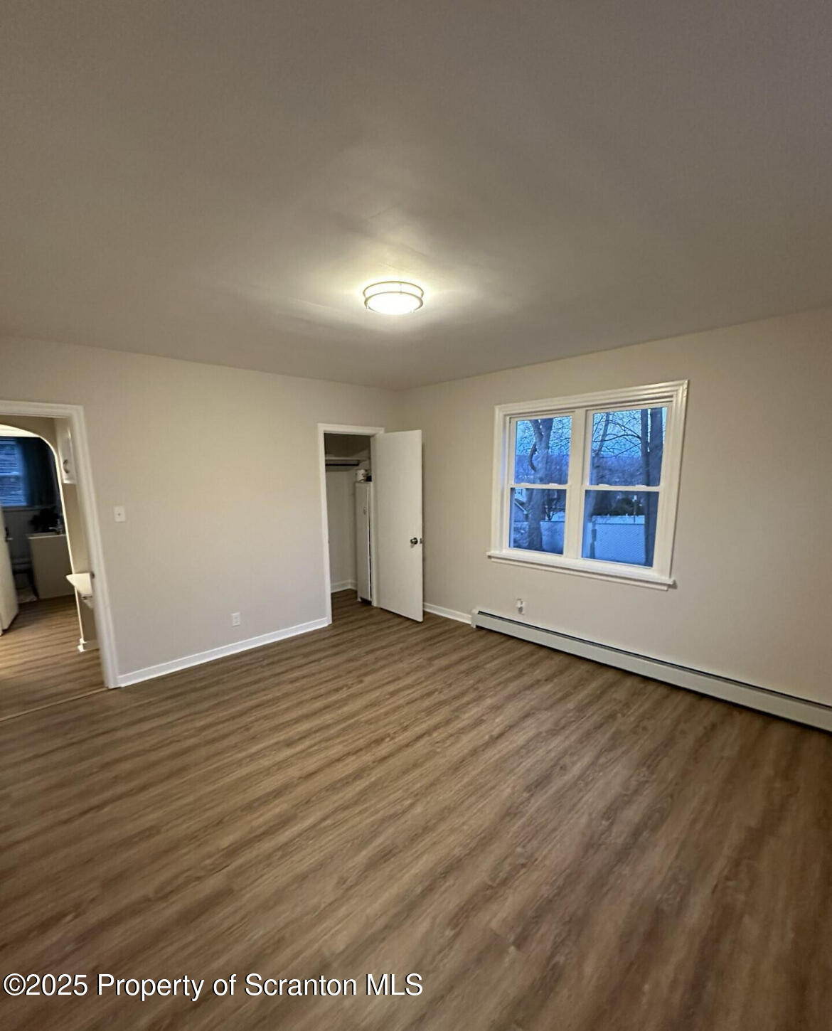 2008 South Webster Avenue Scranton, PA 18505 - Photo 8 of 10 an empty room with wooden floor and windows