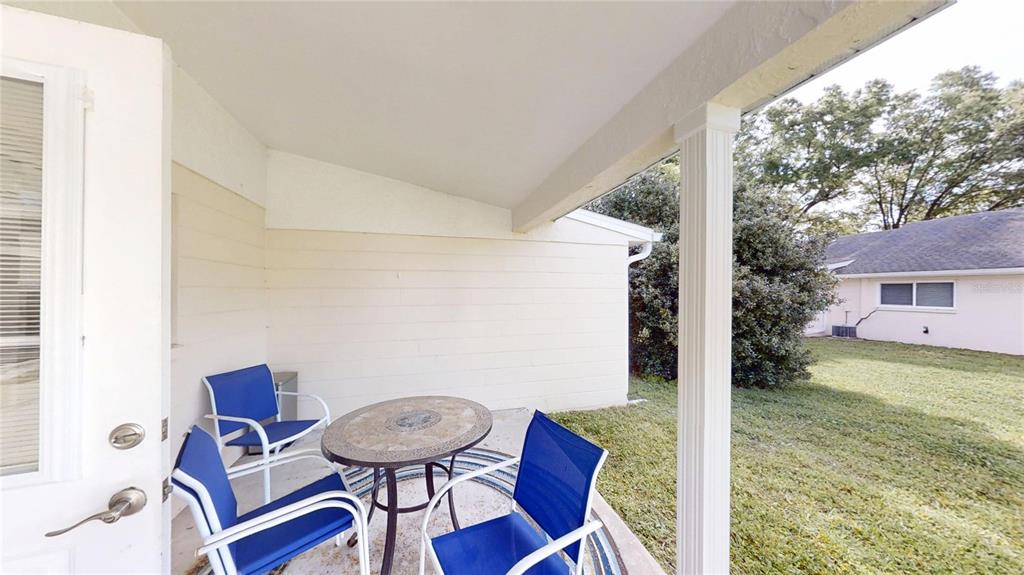 8678 Southwest 95 Street, Unit B Ocala, FL 34481 - Photo 11 of 22 a view of a room that has a table and chairs in it
