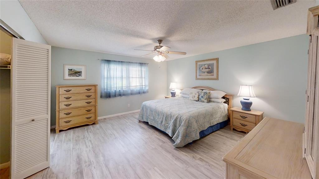 8678 Southwest 95 Street, Unit B Ocala, FL 34481 - Photo 15 of 22 a bedroom with a bed and a tv