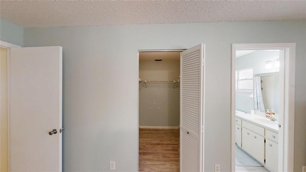 8678 Southwest 95 Street, Unit B Ocala, FL 34481 - Photo 17 of 22 a bathroom with a shower and a sink