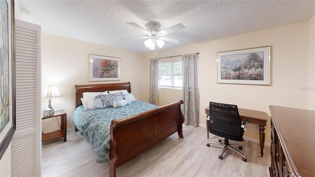 8678 Southwest 95 Street, Unit B Ocala, FL 34481 - Photo 19 of 22 a bedroom with a workspace