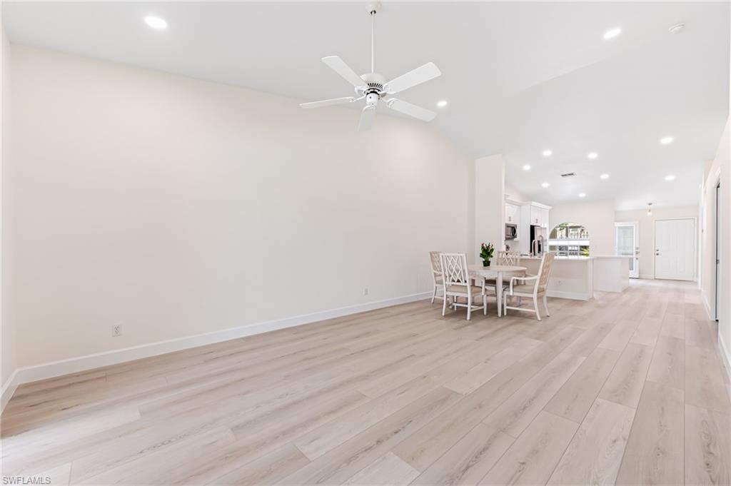 8562 Mustang Drive, Unit 31 Naples, FL 34113 - Photo 11 of 44 Dining area featuring recessed lighting, lofted ceiling, light wood finished floors, baseboards, and ceiling fan