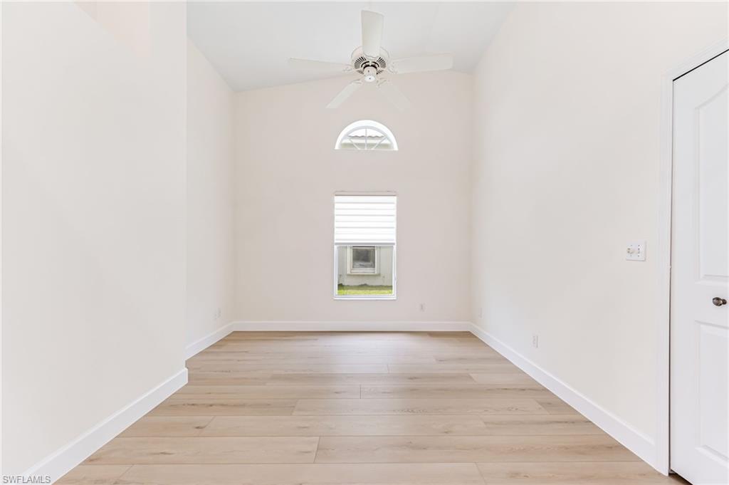 8562 Mustang Drive, Unit 31 Naples, FL 34113 - Photo 22 of 44 Spare room featuring light wood-type flooring, baseboards, and ceiling fan