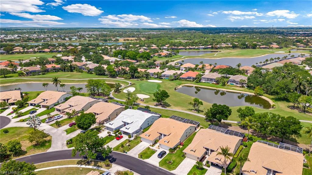 8562 Mustang Drive, Unit 31 Naples, FL 34113 - Photo 33 of 44 Bird's eye view with golf course view, a residential view, and a water view