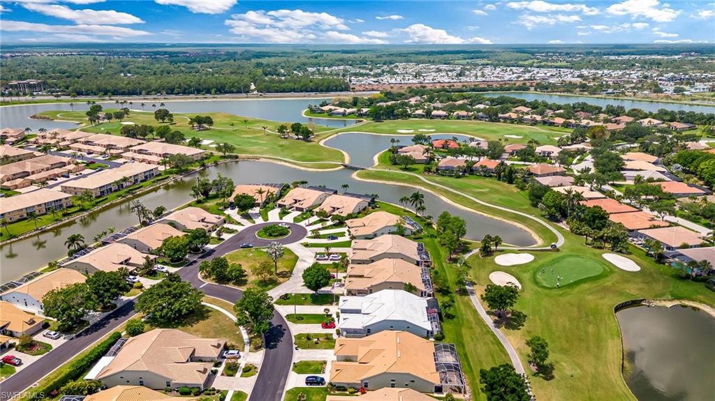 8562 Mustang Drive, Unit 31 Naples, FL 34113 - Photo 35 of 44 Birds eye view of property with a residential view, a water view, and view of golf course
