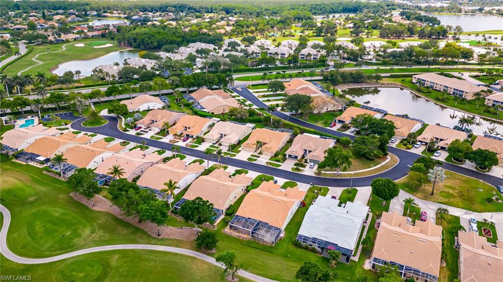 8562 Mustang Drive, Unit 31 Naples, FL 34113 - Photo 41 of 44 Aerial view with a water view and a residential view