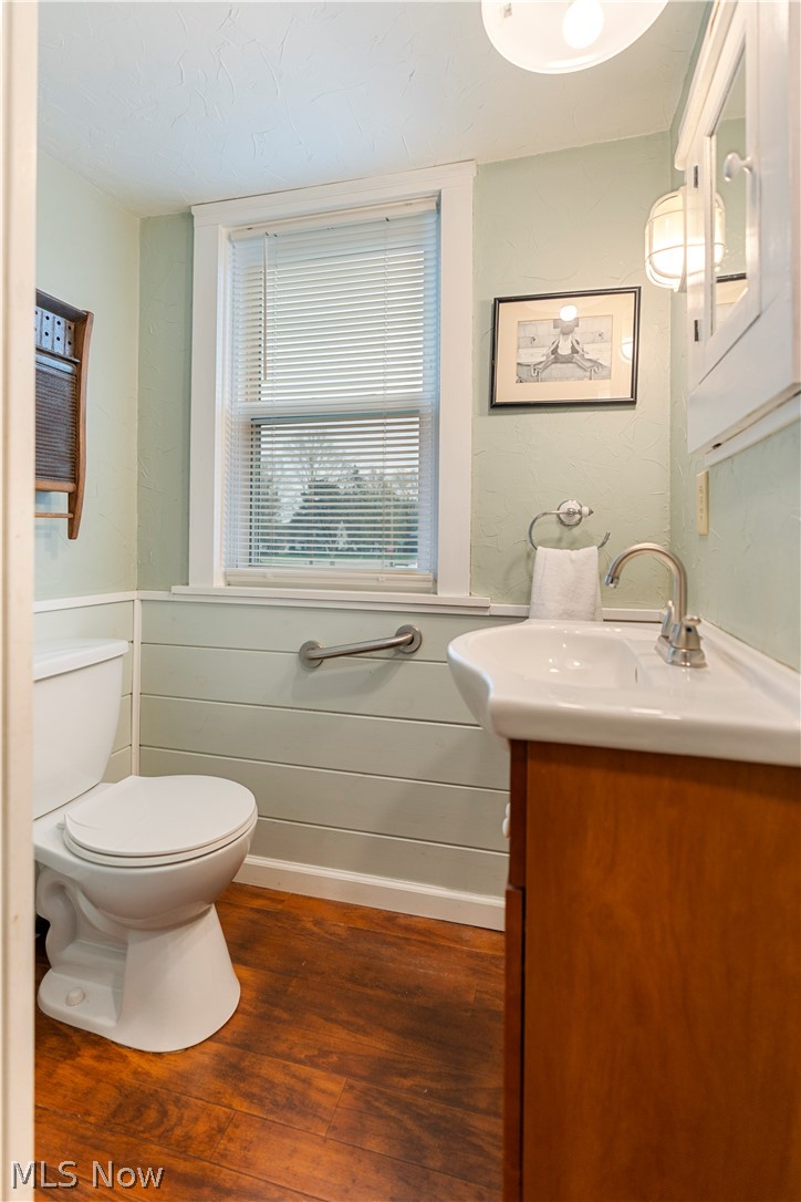 120 34th Street Southwest Canton, OH 44706 - Photo 16 of 30 Bathroom with wood-type flooring, vanity, and toilet