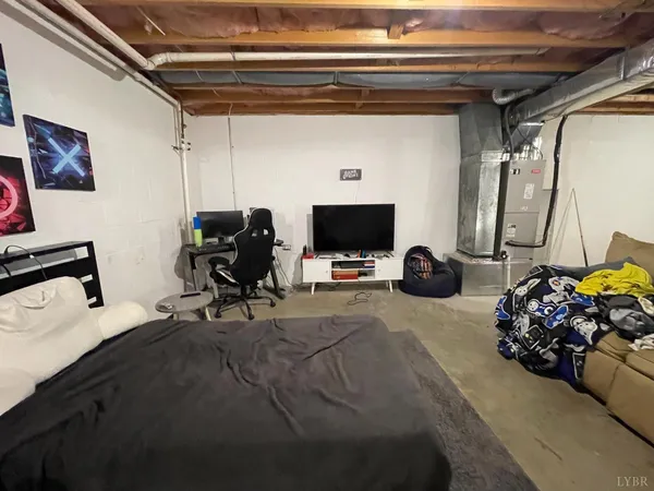 a room with gym equipment and a flat screen tv