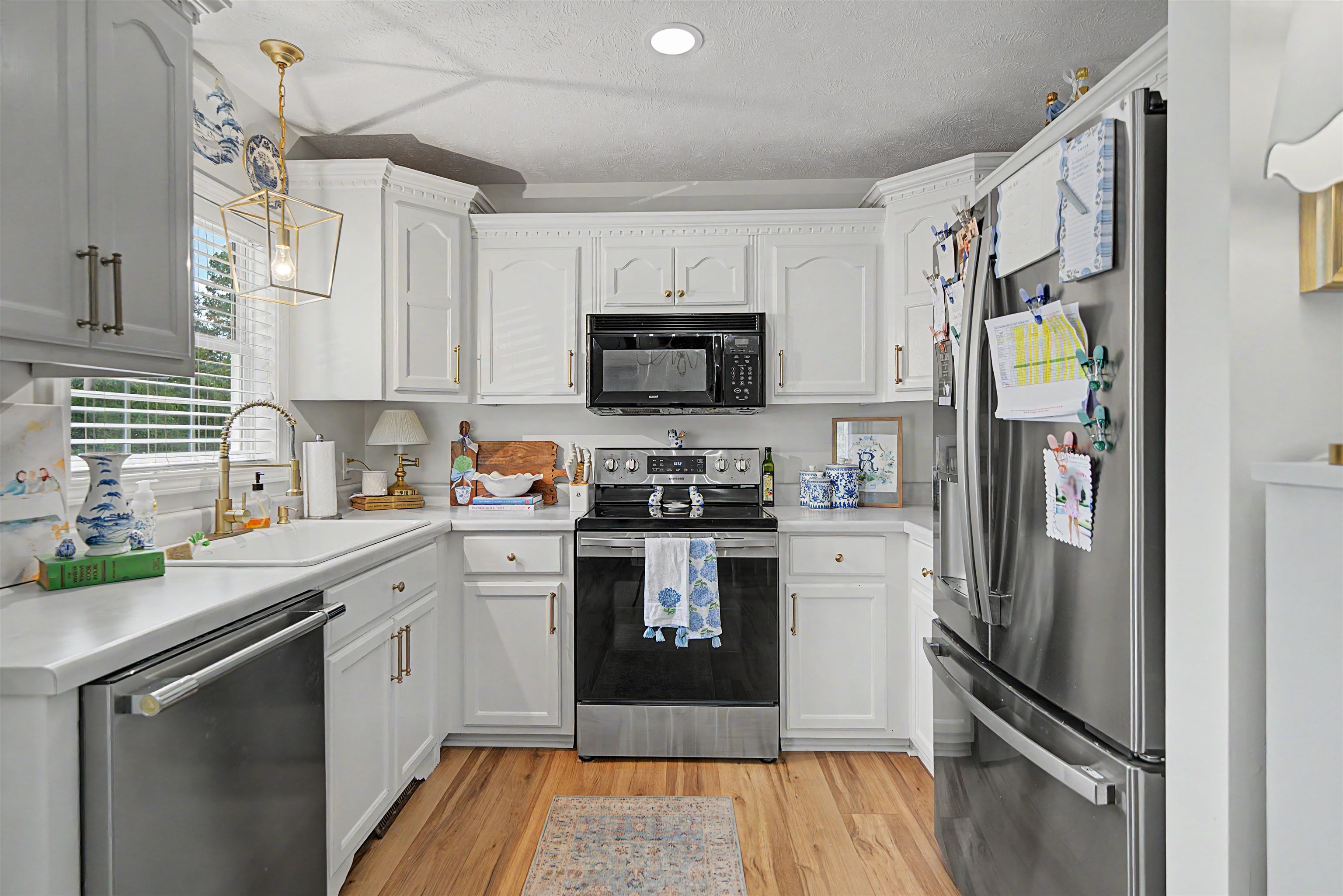 18 Eric Lane Ramer, TN 38367 - Photo 16 of 25 a kitchen with stainless steel appliances granite countertop a refrigerator stove and sink