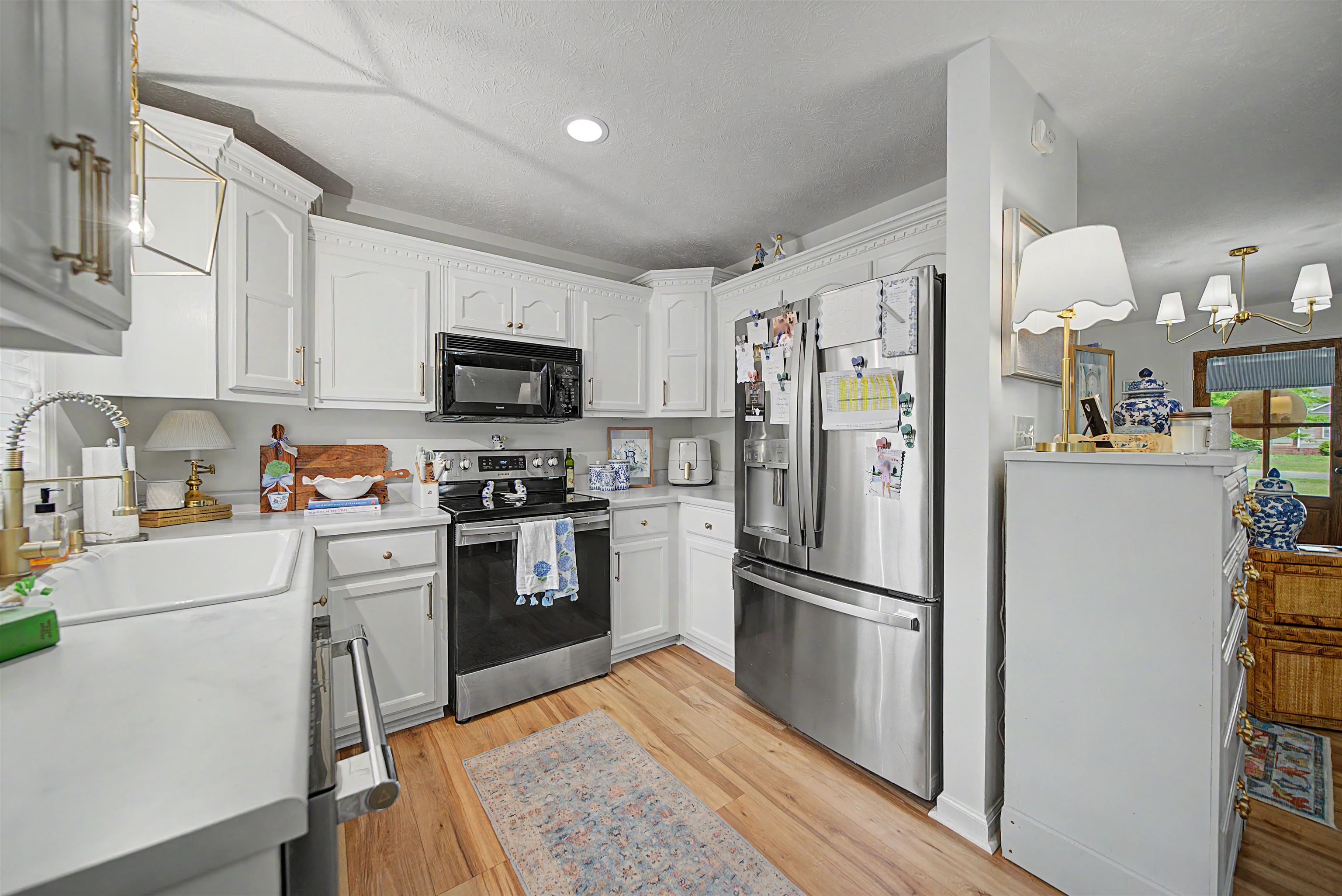 18 Eric Lane Ramer, TN 38367 - Photo 18 of 25 a kitchen with granite countertop a refrigerator stove and microwave