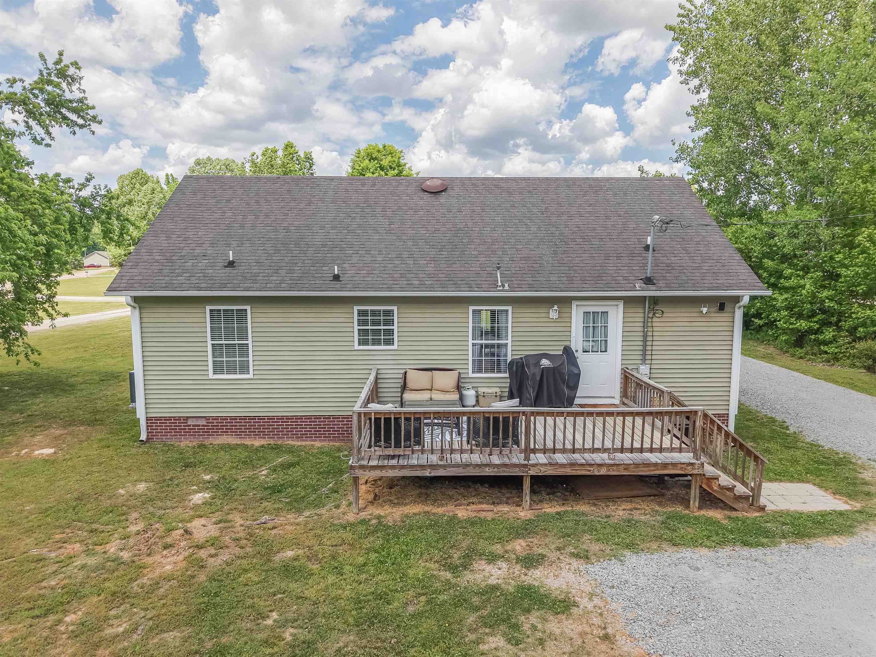 18 Eric Lane Ramer, TN 38367 - Photo 2 of 25 a view of house with a backyard and deck
