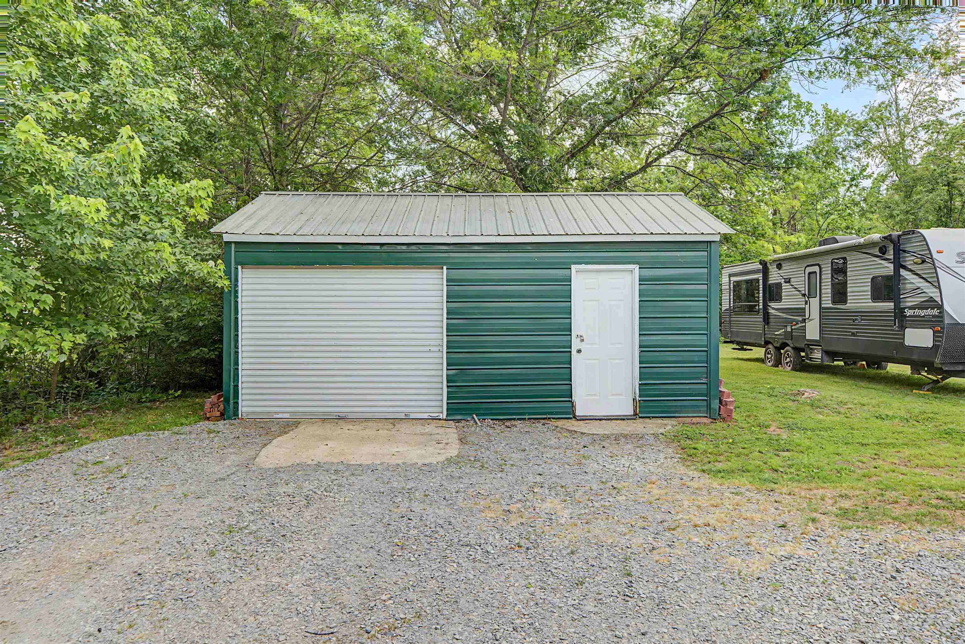 18 Eric Lane Ramer, TN 38367 - Photo 8 of 25 a view of a house with a small yard and large tree