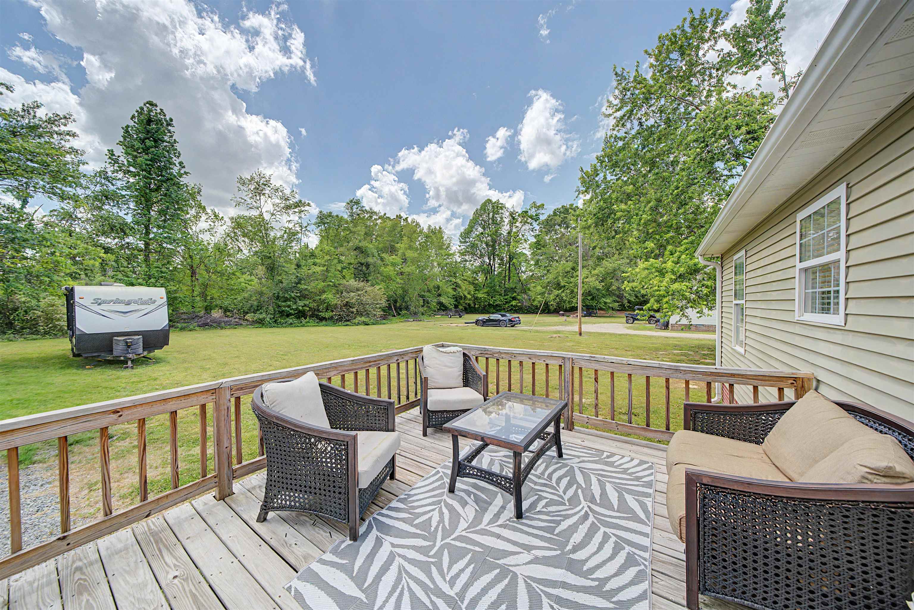 18 Eric Lane Ramer, TN 38367 - Photo 10 of 25 a view of a chair and tables on the roof deck