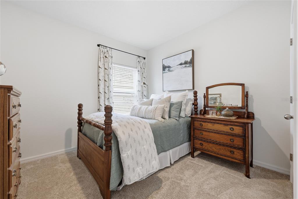 8261 Southwest 60th Avenue Gainesville, FL 32608 - Photo 12 of 34 a bed room with a bed and a window