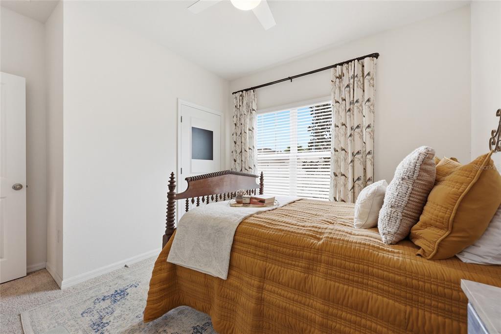8261 Southwest 60th Avenue Gainesville, FL 32608 - Photo 16 of 34 a bedroom with a bed and a mirror