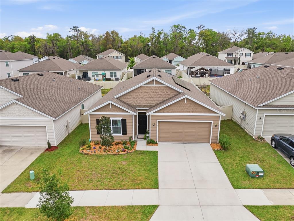 8261 Southwest 60th Avenue Gainesville, FL 32608 - Photo 2 of 34 an aerial view of a house with garden