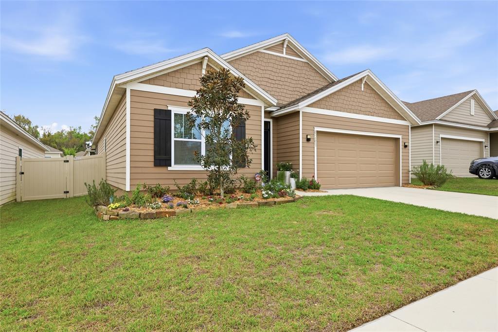8261 Southwest 60th Avenue Gainesville, FL 32608 - Photo 5 of 34 a front view of a house with a yard