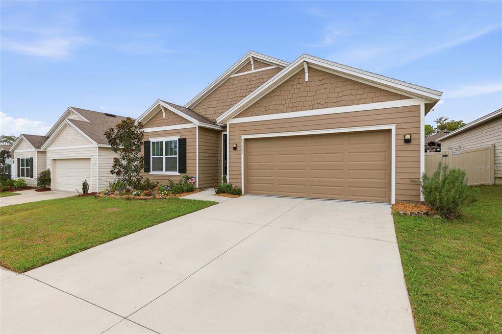 8261 Southwest 60th Avenue Gainesville, FL 32608 - Photo 6 of 34 a front view of a house with a yard