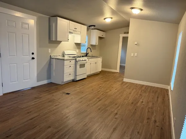 a view of kitchen with wooden floor