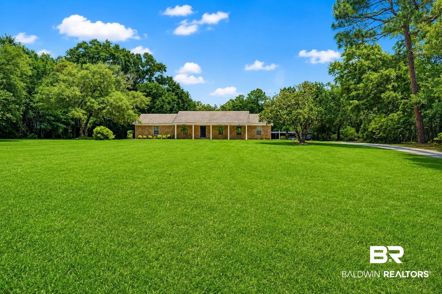 22963 Highway 98 Foley, AL 36535 - Photo 2 of 52 Expansive green lawn fronting a brick ranch-style residence