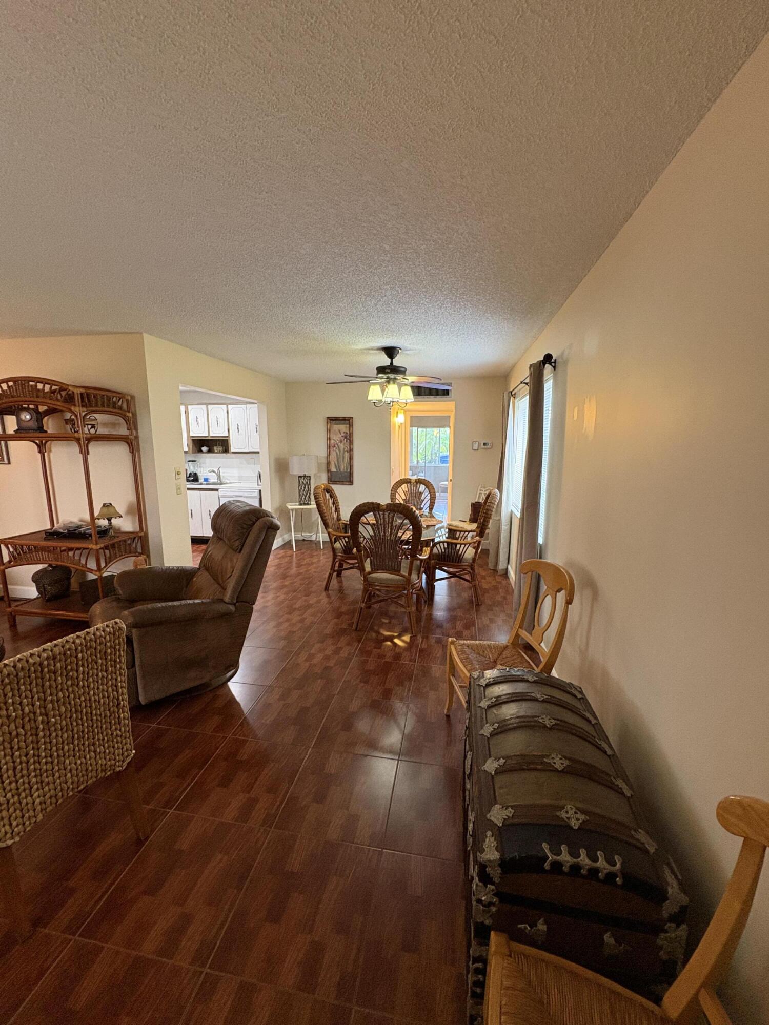 23 Flanders A Delray Beach, FL 33484 - Photo 5 of 21 a living room with furniture and a flat screen tv