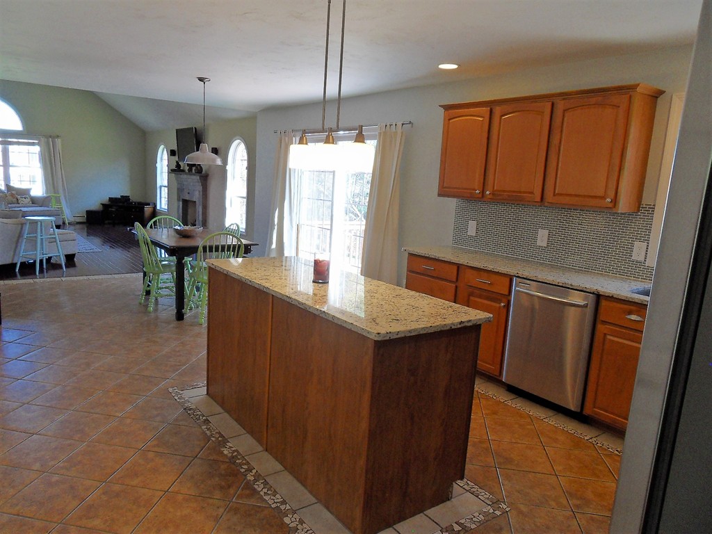 99 Freeman Road Charlton, MA 01507 - Photo 11 of 29 a kitchen with stainless steel appliances granite countertop a sink a stove counter space and cabinets