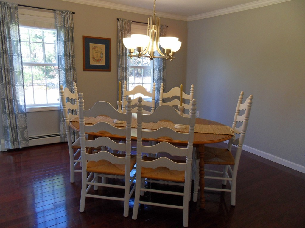 99 Freeman Road Charlton, MA 01507 - Photo 12 of 29 a view of a dining room with furniture wooden floor and chandelier
