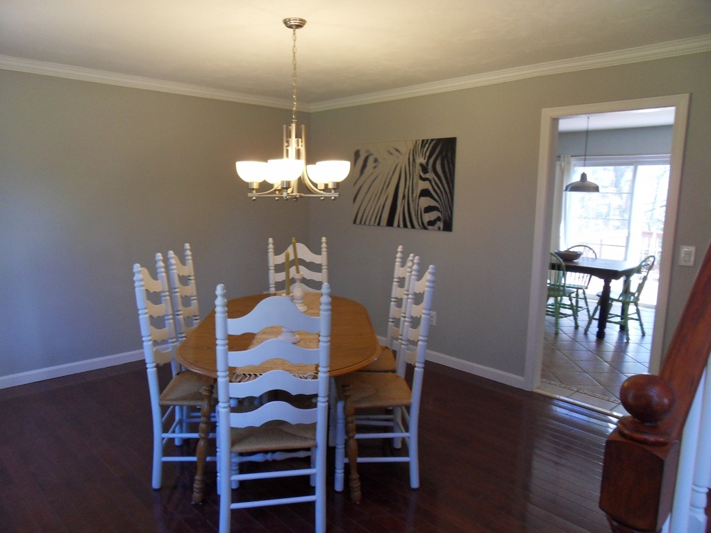 99 Freeman Road Charlton, MA 01507 - Photo 13 of 29 a view of a dining room with furniture wooden floor and chandelier