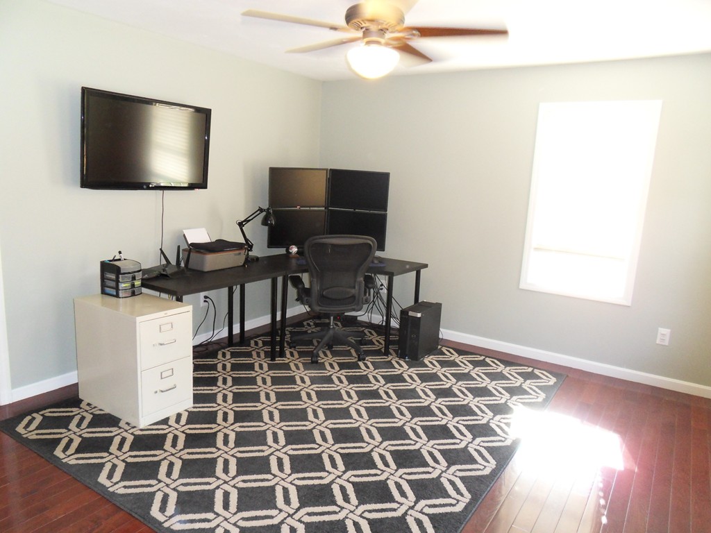 99 Freeman Road Charlton, MA 01507 - Photo 15 of 29 a living room with a flat screen tv and a window