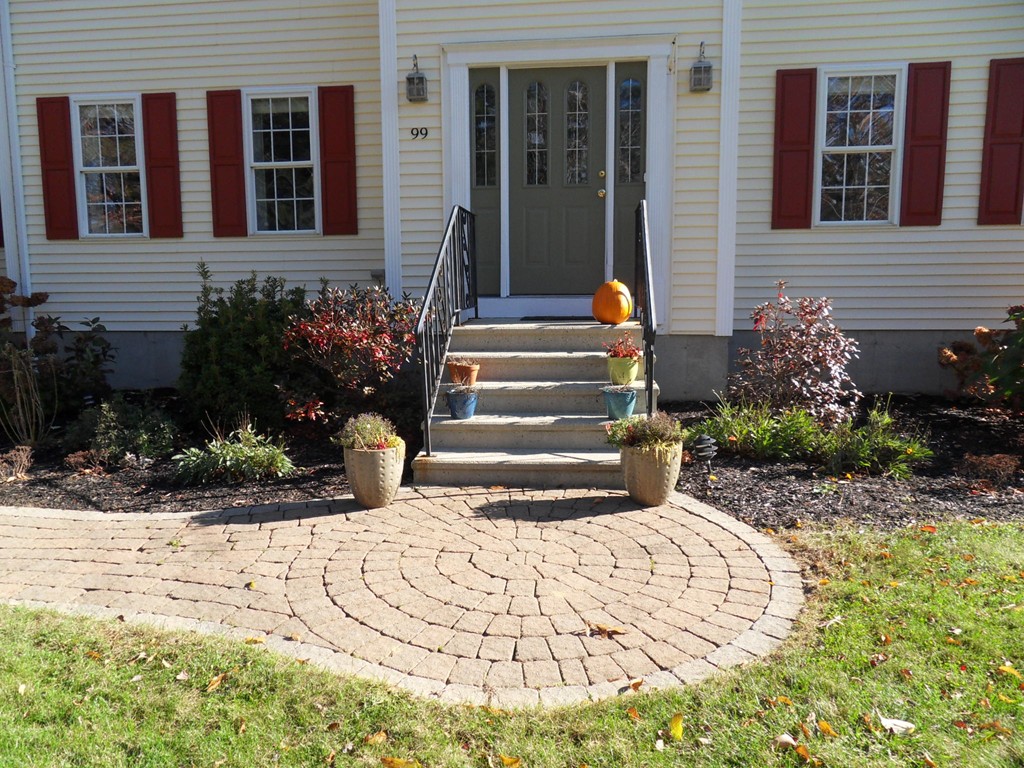 99 Freeman Road Charlton, MA 01507 - Photo 3 of 29 a view of a house with potted plants and a pathway