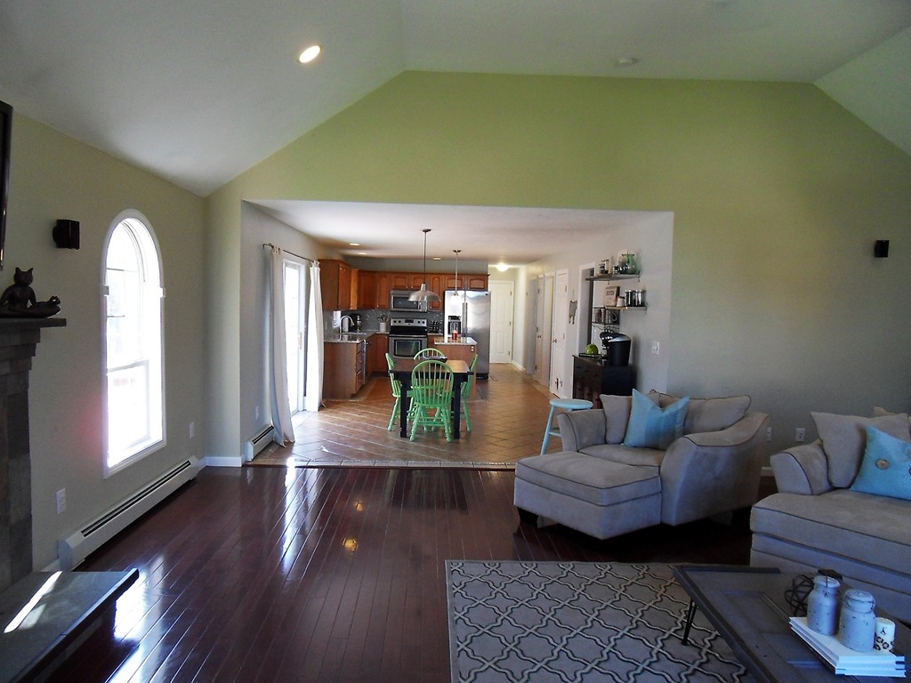 99 Freeman Road Charlton, MA 01507 - Photo 8 of 29 a living room with furniture and a wooden floor
