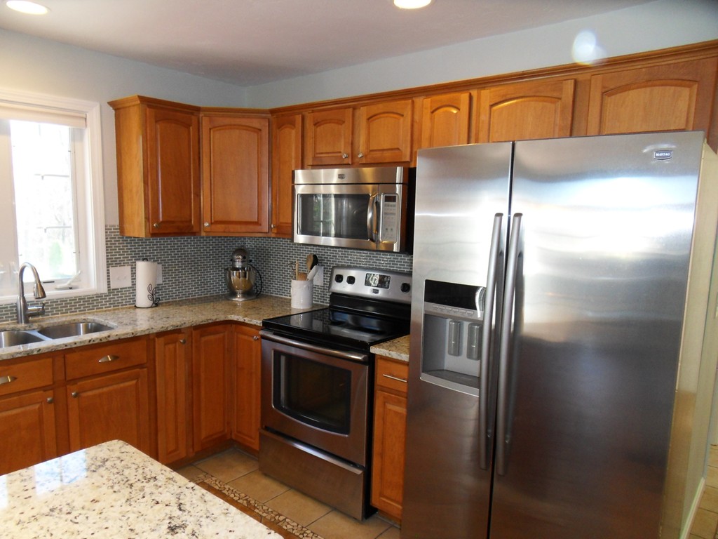 99 Freeman Road Charlton, MA 01507 - Photo 10 of 29 a kitchen with a refrigerator sink and microwave