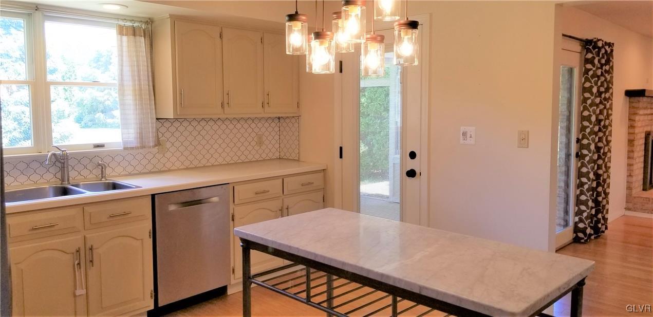 3506 Gun Club Road Nazareth, PA 18064 - Photo 8 of 16 a kitchen with a table chairs and chandelier