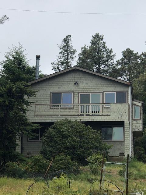 45351 Fish Rock Road Gualala, CA 95445 - Photo 1 of 1 a front view of a house with a garden