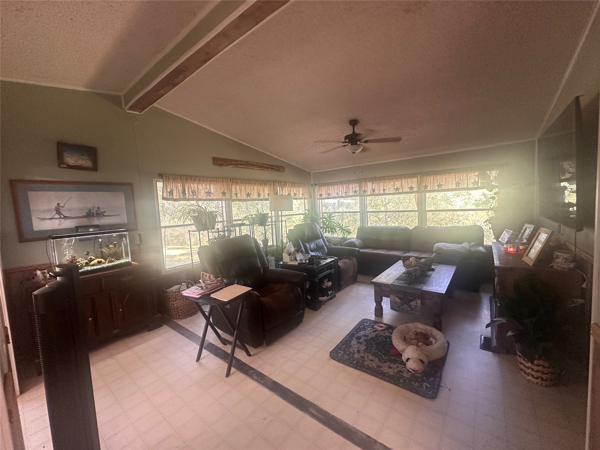 612 Byrd Salyer Road Bay City, TX 77414 - Photo 5 of 32 a living room with furniture hard wood floor and a floor to ceiling window