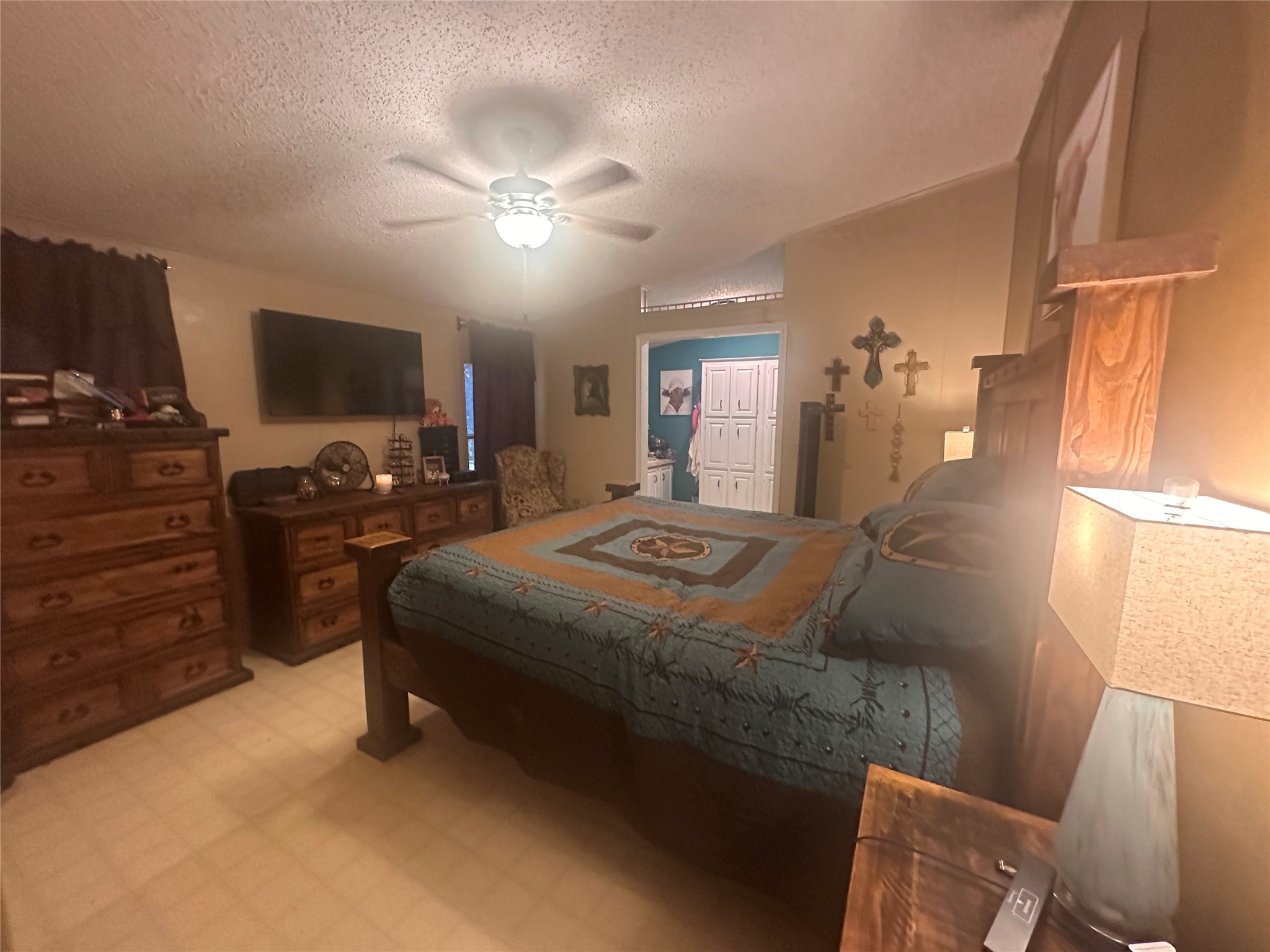 612 Byrd Salyer Road Bay City, TX 77414 - Photo 6 of 32 a bedroom with a bed and flat screen tv