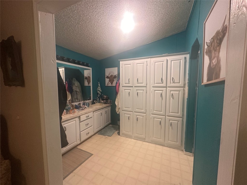 612 Byrd Salyer Road Bay City, TX 77414 - Photo 7 of 26 a kitchen with white cabinets and white appliances