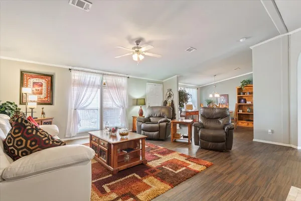 a view of a dining room with furniture and wooden floor