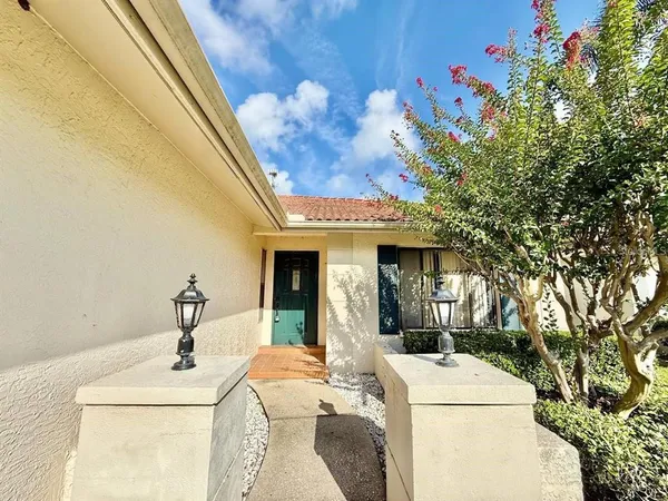a room with a table chair and a fireplace