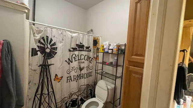 a view of walk in closet with clothes