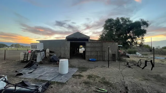 a view of a chair and table in the house