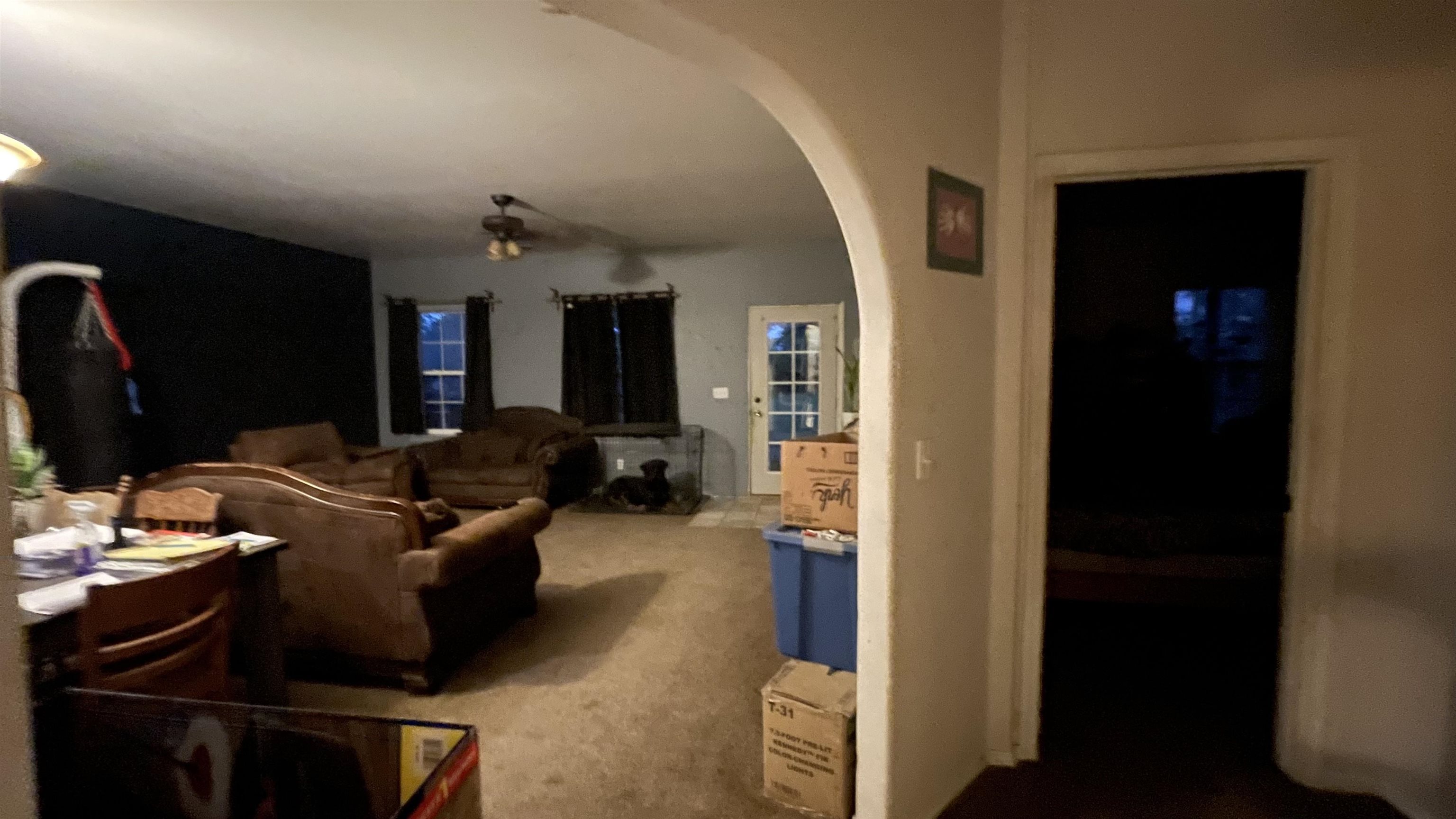 3049 F F 3/4 Road Grand Junction, CO 81504 - Photo 17 of 19 a living room with furniture a flat screen tv and kitchen view