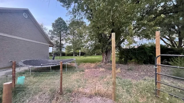 a backyard of a house with lots of green space