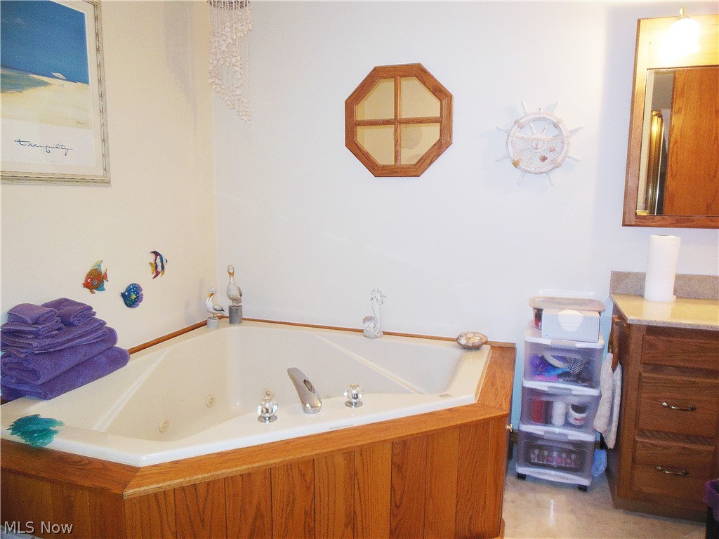 5207 Highway 46 Rome, OH 44085 - Photo 16 of 26 Glamour Bath includes a jetted Tub & separate Shower. Hall entry & private access from the Master Bedroom.